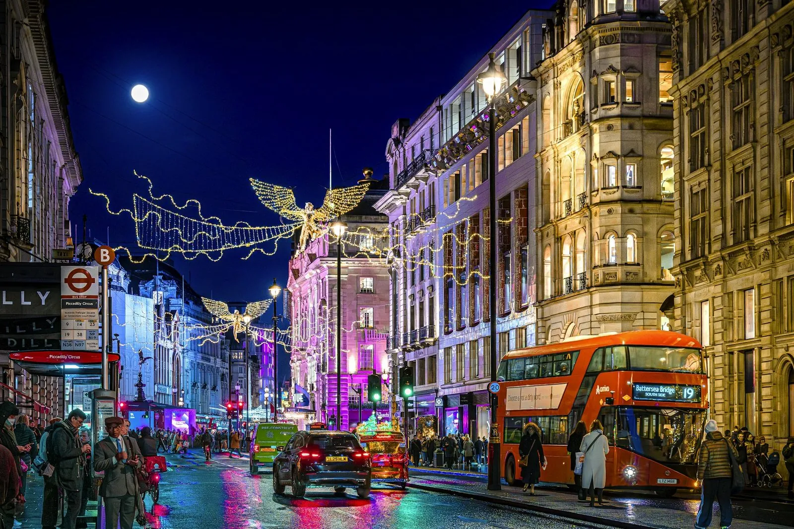 A London street at night strung with Christmas lights, standing in for the moment the festive season starts on UK high streets.