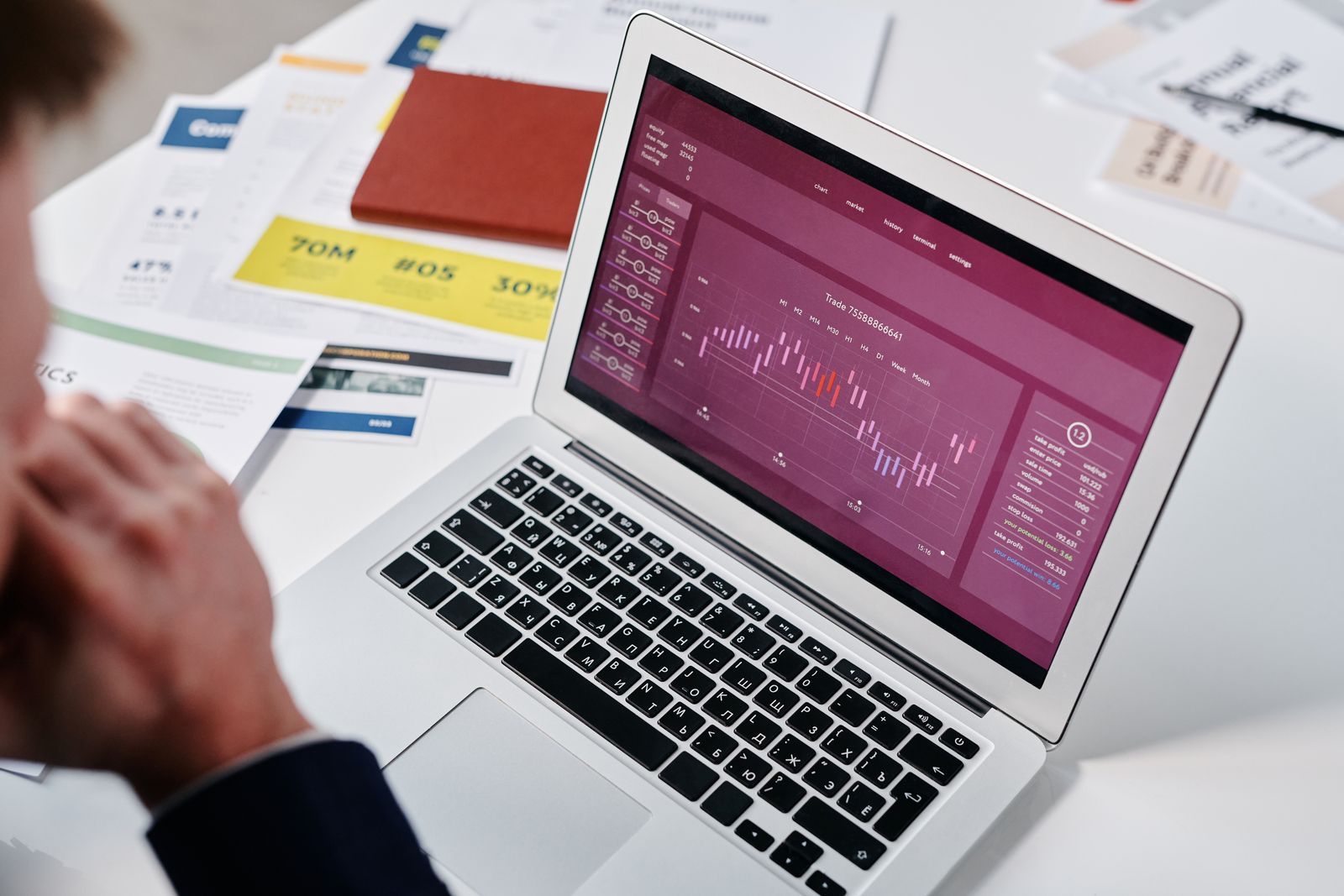 A laptop on a desk showing a purple analytics dashboard with line charts, similar to the conversion data advertisers can now review in the Google Ads All Conversions tab.