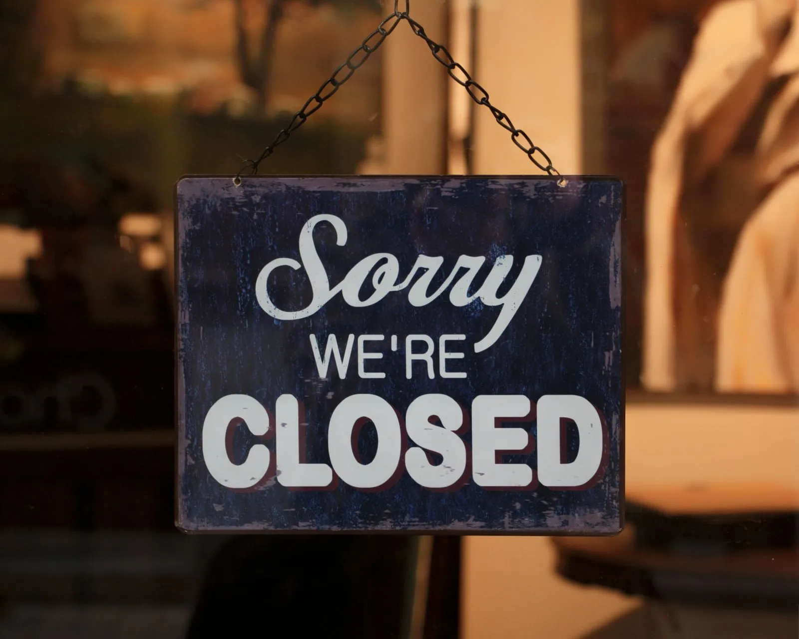 A "Sorry we're closed" sign hanging on a shop door, the kind of notice hundreds of KFC restaurants had to put up during the 2018 chicken crisis before the FCK ad ran.