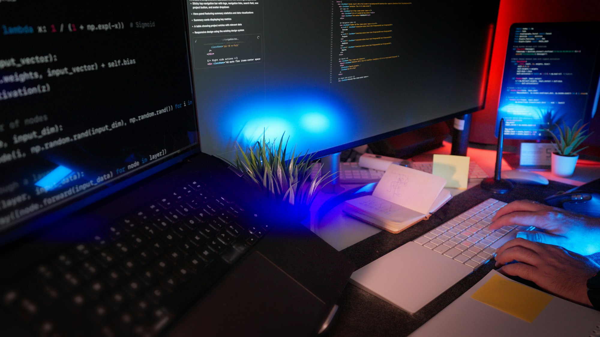 A developer working at a desk with code on several monitors, setting up and testing 301 redirects during a website migration.