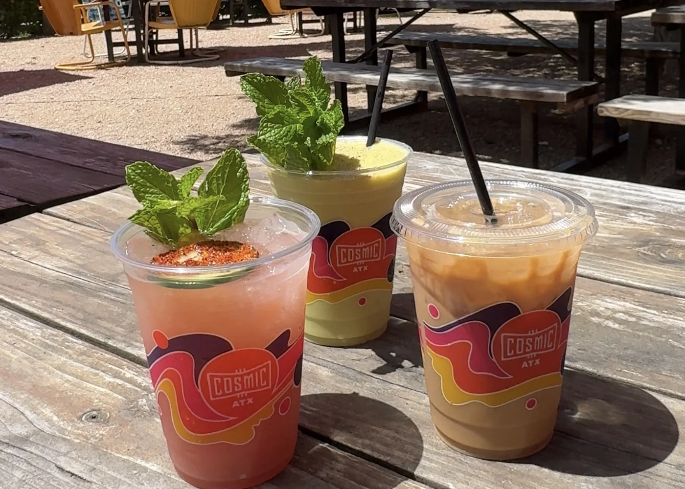 Frozen cocktails on an outdoor table at Cosmic Pickle